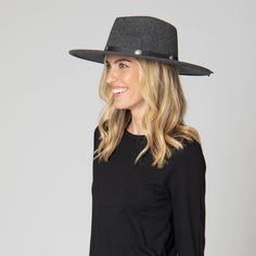 Crafted from luxurious faux felt, this charcoal fedora exudes sophistication and style. Adorned with a silver concho band and tassle ties, it adds a touch of elegance to any outfit. The brim measures 3.75 inches. Available in size 57cm. Features: Color: Charcoal Material: 100% Polyester Size: 57cm Faux Felt Fedora Silver Concho Band with Tassle Ties Brim Size: 3.75" Elegant Gray Brimmed Felt Hat, Elegant Gray Wide Brim Felt Hat, Elegant Gray Fedora For Winter, Fall Gray Fedora Felt Hat, Gray Brimmed Fedora For Fall, Fall Gray Fedora Hat, Adjustable Gray Felt Hat For Fall, Gray Adjustable Felt Hat For Fall, Gray Fedora For Fall