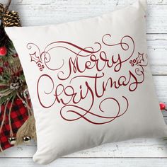 a white pillow with merry christmas lettering on it