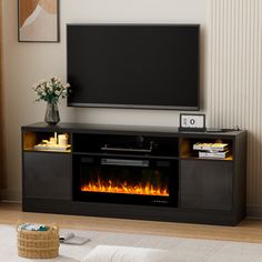 a living room with a television and fire place