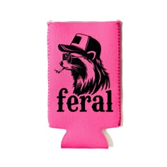 a pink can koozie with the word feral on it and a hat