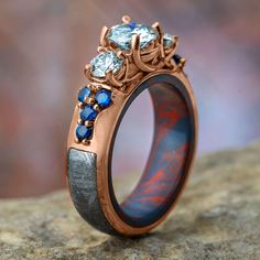 Rose Gold Engagement Ring with Mokume Sleeve Meteorite Jewelry, Magical Items, Forever One Moissanite, Round Rings, Fantasy Jewelry, Engraved Rings, Moissanite Engagement Ring, Moissanite Engagement, Turquoise Ring