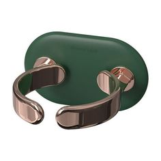 a green leather case with two metal handles on the front and back of each arm