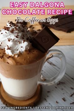 there is a chocolate drink with whipped cream in the cup and some chocolate on top