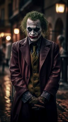 a man dressed as the joker standing on a street