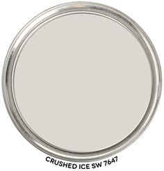 a white round mirror with the words feather gray on it's bottom half - circle