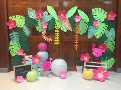 a table topped with paper flowers and vases