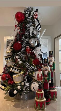 a christmas tree decorated with nutcrackers and ornaments