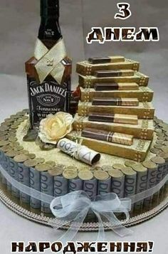 there is a cake that has been made to look like a stack of liquor bottles