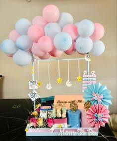 a bunch of balloons that are on top of a table