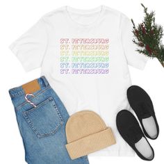 Celebrate self-expression with this vibrant and colorful St. Pete Pride t-shirt! This lightweight and comfortable shirt is made from 100% cotton fabric, and it's a great choice for any season. Perfect for St. Pete pride events, it will make sure you stand out from the crowd and make a statement this Pride Month – order your St. Pete Pride Tee today! • T-SHIRT QUALITY:100% airlume combed and ringspun cotton with ribbed knit collars to bolster shaping and taping at the shoulders for a better fit w Trendy Multicolor Pride T-shirt, Cotton T-shirt With Rainbow Print For Pride, Casual T-shirt For Pride Streetwear, Trendy Rainbow Pride T-shirt, Spring Multicolor Slogan T-shirt, Trendy Rainbow T-shirt For Pride, Trendy Cotton T-shirt With Rainbow Print, Trendy Cotton Pride Tops, Casual Cotton T-shirt For Pride