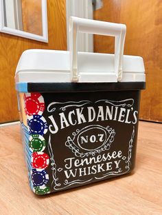 a black and white lunch box sitting on top of a wooden table