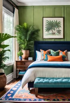 a bedroom with green walls, blue bedding and colorful pillows on the headboard