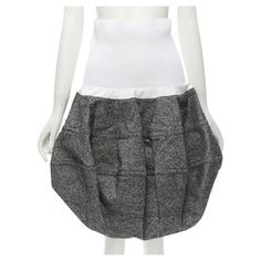 LOUIS VUITTON 2021 Runway white ribbed grey wool dropped bubble skirt FR34 XS Reference: AAWC/A00010 Brand: Louis Vuitton Designer: Nicolas Ghesquiere Collection: Fall Winter 2021 - Runway Material: 100% Wool Color: Grey, White Pattern: Solid Extra Details: Ribbed stretch waist band with internal grosgrain ribbon strap. Grey wool-tweed. 3D bubble cut. Dropped waist skirt silhouette. CONDITION: Condition: Excellent, this item was pre-owned and is in excellent condition. SIZING Designer size: FR34 Short Flared Skirt, Drop Waist Skirt, Louis Vuitton Store, Bubble Skirt, Louis Vuitton Designer, Nicolas Ghesquiere, Lv Monogram, Louis Vuitton Shoulder Bag, Vintage Louis Vuitton