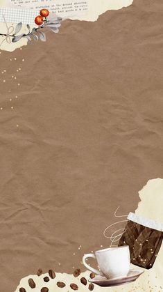 a cup of coffee sitting on top of a saucer next to a piece of paper