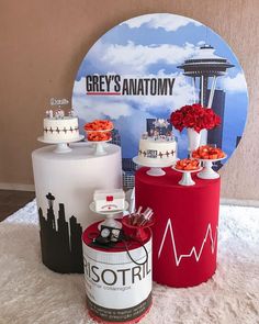 several cakes and desserts are on display in front of a grey's anatomy sign