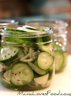 pickled cucumbers and onions in a glass jar