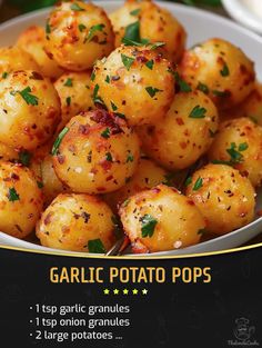 garlic potato pops in a white bowl on a table