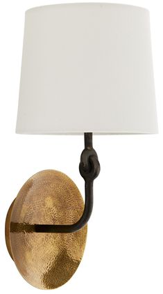 a lamp that has a white shade on it