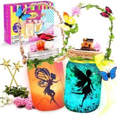 two mason jars with fairy images on them and flowers in front of the jar is an ornament