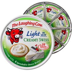 the laughing cow light creamy swiss is in a tin with four different toppings