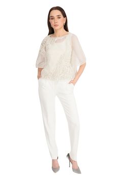 Off white mesh top with patterned bead embroidery in front and flared sleeves.
Component: 1
Pattern: Embroidery
Type Of Work: Beads
Neckline: Straight
Sleeve Type: Flared Sleeves
Fabric: Mesh
Color: Off White
Other Details: 
Note: The inner top and pant worn by the model is not for sale
Occasion: Party - Aza Fashions White Formal Tops With Sheer Sleeves, White Formal Top With Sheer Sleeves, White Sheer Sleeves Top For Formal Occasions, Formal White Tops With Sheer Sleeves, White Organza Evening Top, Formal White Blouse With Sheer Sleeves, Elegant Fitted Organza Top, Formal Organza Tops For Spring, Elegant Sequin Organza Blouse