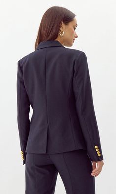 This bold blazer is adorned with gold buttons on the bodice and sleeves. The double-breasted structure also features faux, front pockets and a notched lapel. Can be matched with Colson Trousers. Blazer Double-Breasted Lined Length: 26" Chest: 17 1/4" Self: 77% Polyester, 16% Viscose, 7% Spandex Lining: 97% Polyester, 3% Spandex Hand wash in cold water with similar colors. Model is wearing a size small Style #: G247J1755 Office Blazer Dress With Double-breasted Button Fastening, Office Blazer Dress With Double-breasted Buttons, Structured Double-breasted Office Blazer, Structured Double-breasted Blazer For Office, Chic Workwear Blazer With Gold Buttons, Double-breasted Fitted Blazer Dress With Gold Buttons, Chic Double-breasted Blazer With Gold Buttons, Double Breasted Long Sleeve Suit For Work, Fitted Double-breasted Blazer Dress With Gold Buttons