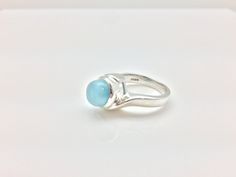 Hi everyone, just wanted to let you know we are open and shipping daily. Larimar Silver Ring // 925 Sterling Silver // Oval Setting // Sky Blue Larimar // Size 6 This infamously rare Caribbean gemstone is found only in the Dominican Republic where it is mined and sold in limited quantities. I have laboriously sorted through thousands of stones hand picking only the ones with exceptional aqua and sky blue color sought after by most collectors. I think you will notice the difference in workmanship Blue Larimar Moonstone Ring, Larimar Earrings, Oval Setting, Larimar Ring, Sky Blue Color, Larimar Rings, White Pearl Earring, Herringbone Necklace, Turquoise Ring Silver