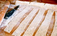 a knife is laying on top of some bread slices and sprinkled with powdered sugar