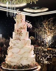 a large white cake sitting on top of a table