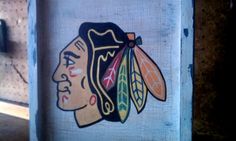 an image of a painting on the side of a building with a chicago black hawks logo