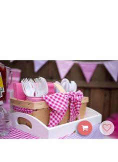 a basket filled with lots of different types of utensils on top of a table