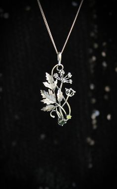 ITEM DESCRIPTION: The size H 5 cm x W 3 cm (2 x 1 1/3 inch). Weight - 5 g. You can buy it with a silver chain or without it. Even simple plants look very elegant. I made one of sterling silver, pretty green tourmaline, and peridot. This unique botanical jewelry looks like a real treasure of wild forest. It is really worthy of being in your precious collection. Expect many compliments on this! This handmade necklace will come to you in a gift box - ready for gifting. The parcel will be sent durin Silver Nature-inspired Necklace With Flower Charm, Silver Necklace With Nature-inspired Flower Charm, Delicate Green Sterling Silver Necklaces, Delicate Green Sterling Silver Necklace, Delicate Green Sterling Silver Jewelry, Sterling Silver Birth Flower Pendant Jewelry, Sterling Silver Birth Flower Pendant, Nature-inspired Sterling Silver Flower Jewelry, Botanical Sterling Silver Jewelry Gift