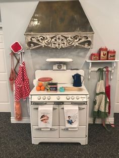 an old fashioned white stove in a kitchen