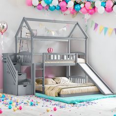 a child's bedroom with a bunk bed and slide in the middle, decorated with balloons