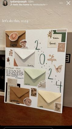 an image of a greeting card with envelopes and numbers on the front, along with other cards