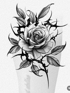 a black and white rose tattoo design on the back of a woman's leg