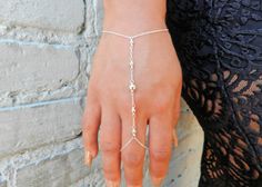 Hand Crafted Sterling Silver Dainty Hand Chain....#sterlingsilverjewelry #christmasgift #blackfriday #holidayshopping #layeredbracelet #stackingbracelet #holidaygift #momgift #handchain #slavebracelet #fingerbracelet #ringbracelet #handmade #handcrafted #handmadejewelry #minimalistbracelet #bohobracelet #silverbracelet #daintybracelet #fashion #accessories Adjustable Sterling Silver Body Jewelry For Party, Adjustable Silver Body Jewelry Gift, Silver Adjustable Body Jewelry For Gift, Minimalist Silver Body Jewelry For Party, Minimalist Adjustable Body Jewelry For Gift, Adjustable Minimalist Body Jewelry Gift, Spiritual Style Bracelet Jewelry For Party, Spiritual Silver Body Jewelry For Gift, Adjustable Silver Spiritual Body Jewelry