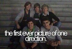 a group of young men sitting next to each other in front of stairs with the words, the first ever picture of one direction