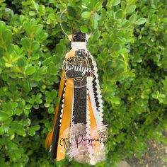 an ornament hanging from a tree with the words today written on it's ribbon