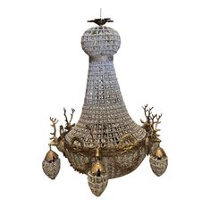 an elaborate chandelier with deer heads and antlers on the bottom part of it