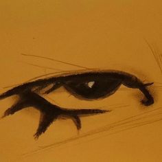 a drawing of an eye that is drawn in pencil and watercolor on yellow paper