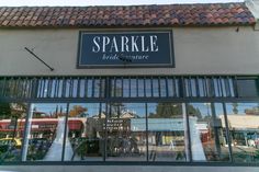 the entrance to sparkle bridal boutique with its reflection in the glass windows and red tiled roof