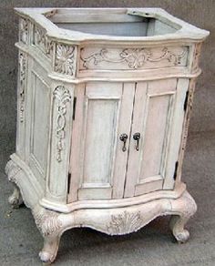 an old white cabinet is sitting on the ground