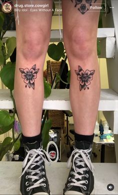 the legs and ankles of a woman with tattoos on them