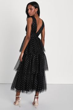 If you're dressing to impress at your next event, let the Lulus Decadent Impression Black Tulle Tiered Shiny Dot Midi Dress be your solution! Airy tulle features shiny reflective accents in rose gold and silver as it shapes a sleeveless bodice with a plunging V-neckline, matching V-back, and banded waist. Voluminous skirt has an A-line silhouette and falls in floaty tiers (with extra tulle for volume) to a long midi hem. Hidden zipper/clasp at back. Fit: This garment fits true to size. Length: M Black Lace And Tulle Dress, Black Dress With Stars, Tiered Tulle Dress, Vertical Striped Dress, Voluminous Skirt, Tulle Midi Dress, Cute Floral Dresses, Black Floral Maxi Dress, Long Midi