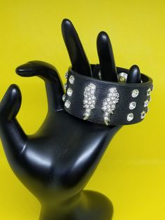 "Badass vintage bracelet! I just came across a few GREAT jewelry pieces from my Punk 80's days.... This bracelet is an adjustable faux leather or (vegan) bracer/cuff.. Silver finish Angel wings with clear crystals and 24 studded crystal rhinestones set in the faux leather. 1.25\" inch wide band, and 8.25\" inches long, and it has never been worn, so it is in Excellent vintage condition. This one and others were bought on one of my trips to London, back in the late 80's. Thanks, Enjoy! #tattoos # Jewelry Tattoos, Rocker Look, Y2k Accessories, Jewelry Tattoo, Punk Rocker, Jewelry Fashion Trends, Gothic Punk, Funky Jewelry, Bracelet Cuff