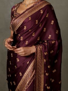 Editor's Note Elevate your style with our prune ari-hand embroidered girija sari, complete with an unstitched blouse. This ensemble is perfect for special occasions, exuding elegance and charm with its intricate embroidery and rich color. With the added convenience of an unstitched blouse, you can customize your look to your liking, making it a truly personalized attire. Make a lasting impression at any event with this classic and timeless outfit that effortlessly combines tradition and modernit Elegant Dola Silk Fabric With Unstitched Blouse, Elegant Dola Silk Embroidered Fabric With Unstitched Blouse, Elegant Dola Silk Fabric For Unstitched Blouse, Elegant Embroidered Dola Silk Fabric With Unstitched Blouse, Formal Art Silk Choli With Zari Work, Formal Zari Work Choli For Diwali, Formal Choli With Zari Work For Diwali, Formal Diwali Choli With Zari Work, Formal Resham Embroidery Blouse Piece For Navratri