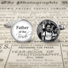 the father of the bride cufflinks are shown on top of an old newspaper