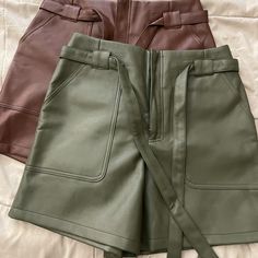 New Without Tags 2 Faux Leather Shorts. 1 Chocolate Color And 1 Olive Green Color. Trendy Faux Leather Bottoms For Day Out, Faux Leather Workwear Shorts, Trendy Faux Leather Belted Bottoms, Faux Leather Shorts With Belt Loops For Work, Trendy Belted Faux Leather Bottoms, Faux Leather Workwear Shorts With Belt Loops, Workwear Faux Leather Shorts With Belt Loops, Spring Faux Leather Shorts With Belt Loops, High Waist Faux Leather Shorts With Pockets