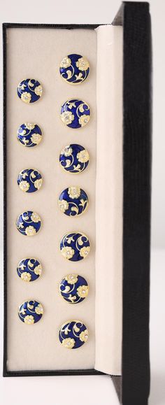 Imitation Jewelry: Bandhgala Buttons for Man Meenakari Handmade Blue and Gold Shank Buttons Set. Perfect For Gifting. Great for garment, Kurta & Sherwani, Jodhpuri Coat, Bandhgala suits, and Nehru jacket. Craftsmanship - made of brass, resin, excellent finish, detailing at its best. Tender with hand to maintain the natural look MADE IN INDIA  These luxurious buttons feature intricate gold floral detailing on a rich blue enamel base, adding a touch of elegance to any outfit. Perfect for traditional or formal wear, these buttons come in a premium set of 13, ensuring a complete look that elevates your attire with sophistication and style. These Buttons are crafted from Copper-Brass Metal and are digold Plated. They come in a set of 13, with seven large buttons and six small buttons in a box w Elegant Blue Sets With Motifs, Nehru Jacket, Jewelry Men, Gold And Blue, Nehru Jackets, Shank Button, Large Buttons, Copper Brass, Gold Floral